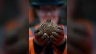 Roman pot uncovered at the archaeological excavation of a Roman trading settlement, Blackgrounds, South Northamptonshire