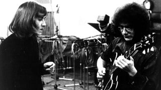 Lyricist Peter Sinfield and guitarist Robert Fripp of the first lineup of the English rock band "King Crimson" record in the studio in 1969.