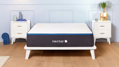 Nectar mattress discount image with mattress on white bed in blue room 