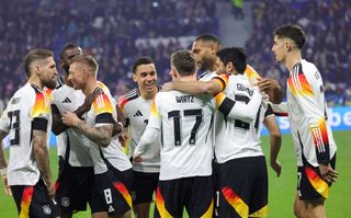 Florian Wirtz of Germany celebrates with teammates after scoring his teams first goal during the international friendly match between France and Germany at Groupama Stadium on March 23, 2024 in Lyon, France.(Photo by Ralf Ibing - firo sportphoto/Getty Images) Germany Euro 2024 squad