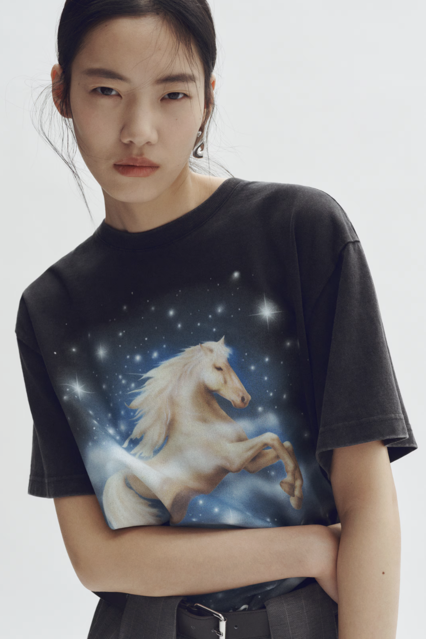 a model wearing an H&amp;amp;M x stella mccartney tshirt