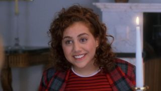 Brittany Murphy smiling at the dinner table in Clueless.
