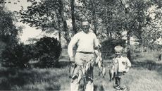 David Booth and his dad show off their catch after a day of fishing.