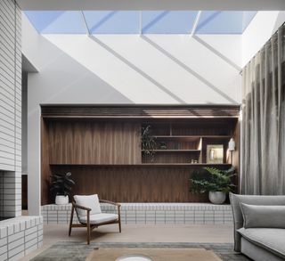 A living room with black and white metro tiles