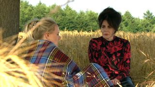 Faith finds Tracy in a field in Emmerdale.