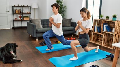 Two people doing a HIIT workout at home