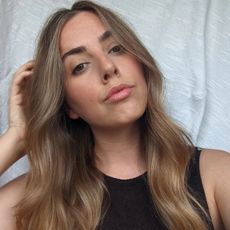 Beauty Director Shannon Lawlor taking a selfie with wavy hair