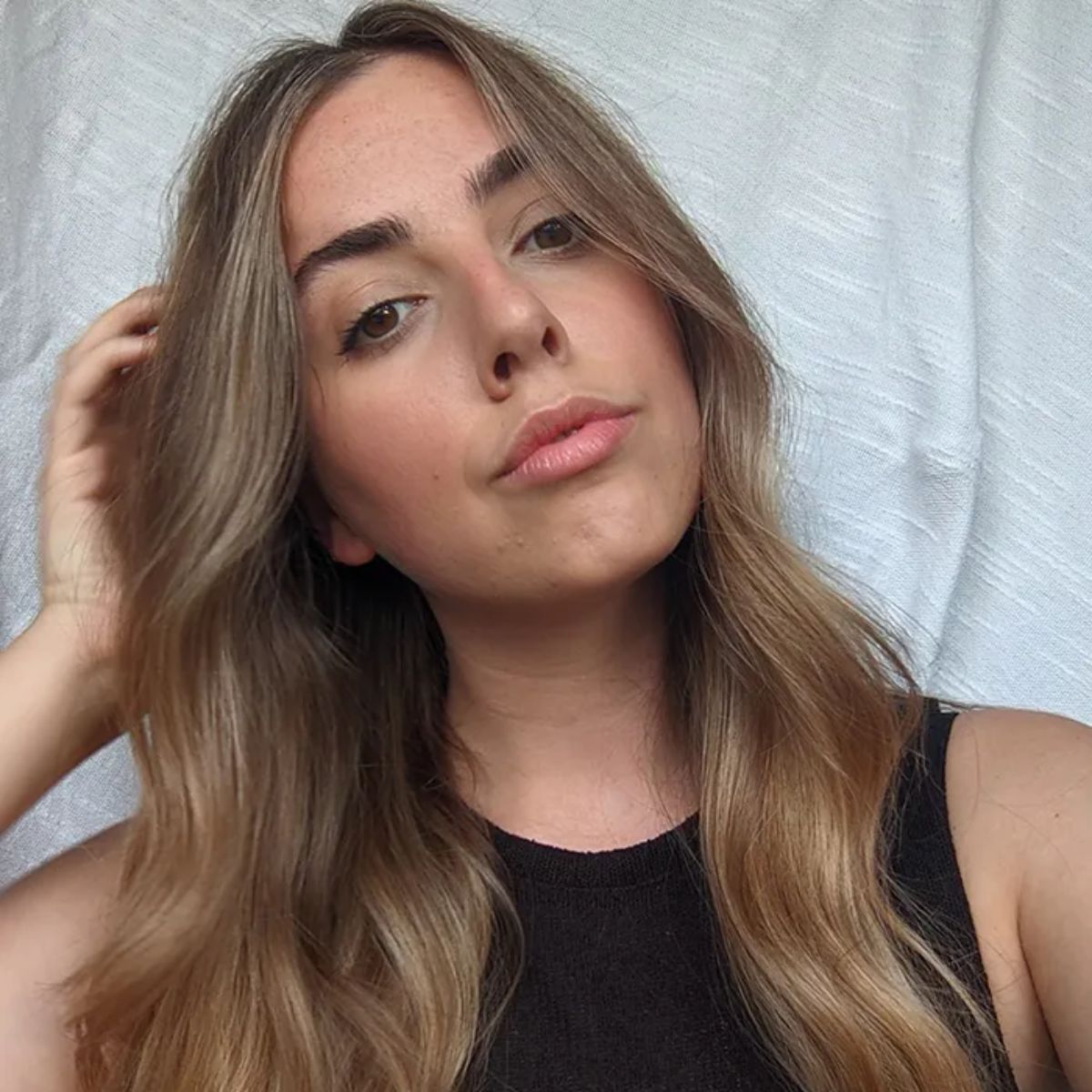 Beauty Director Shannon Lawlor taking a selfie with wavy hair