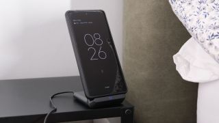 Anker 313 Wireless Charging Stand on a wooden surface
