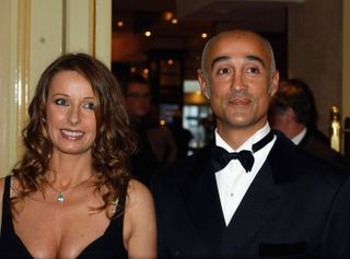 Keren Woodward (left) and Andrew Ridgeley (right) at a black tie event