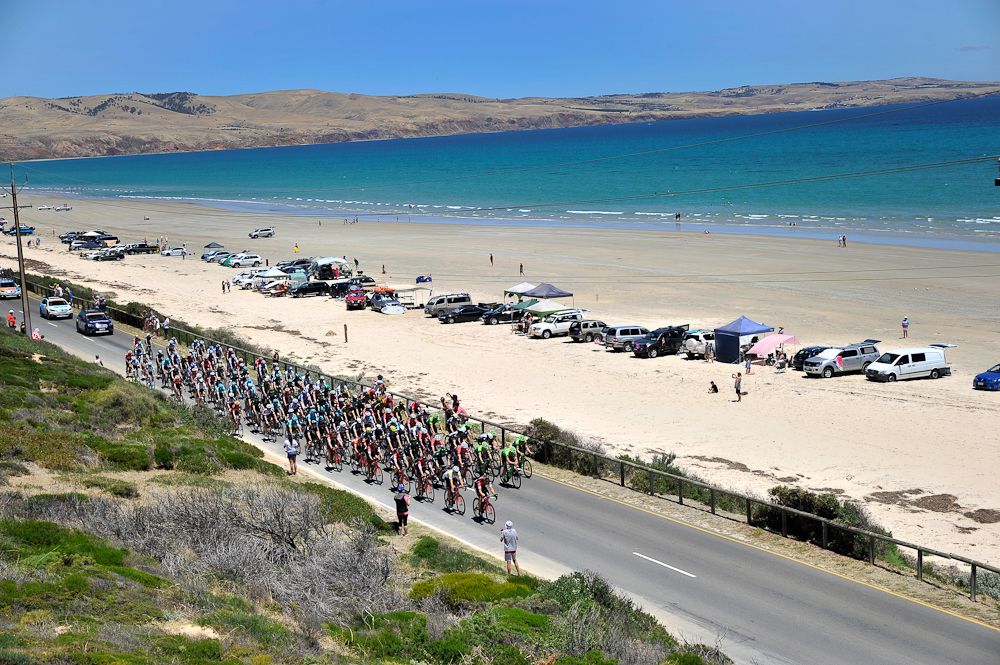 The peloton rides along the coast during stage 5 at the Tour Down Under.