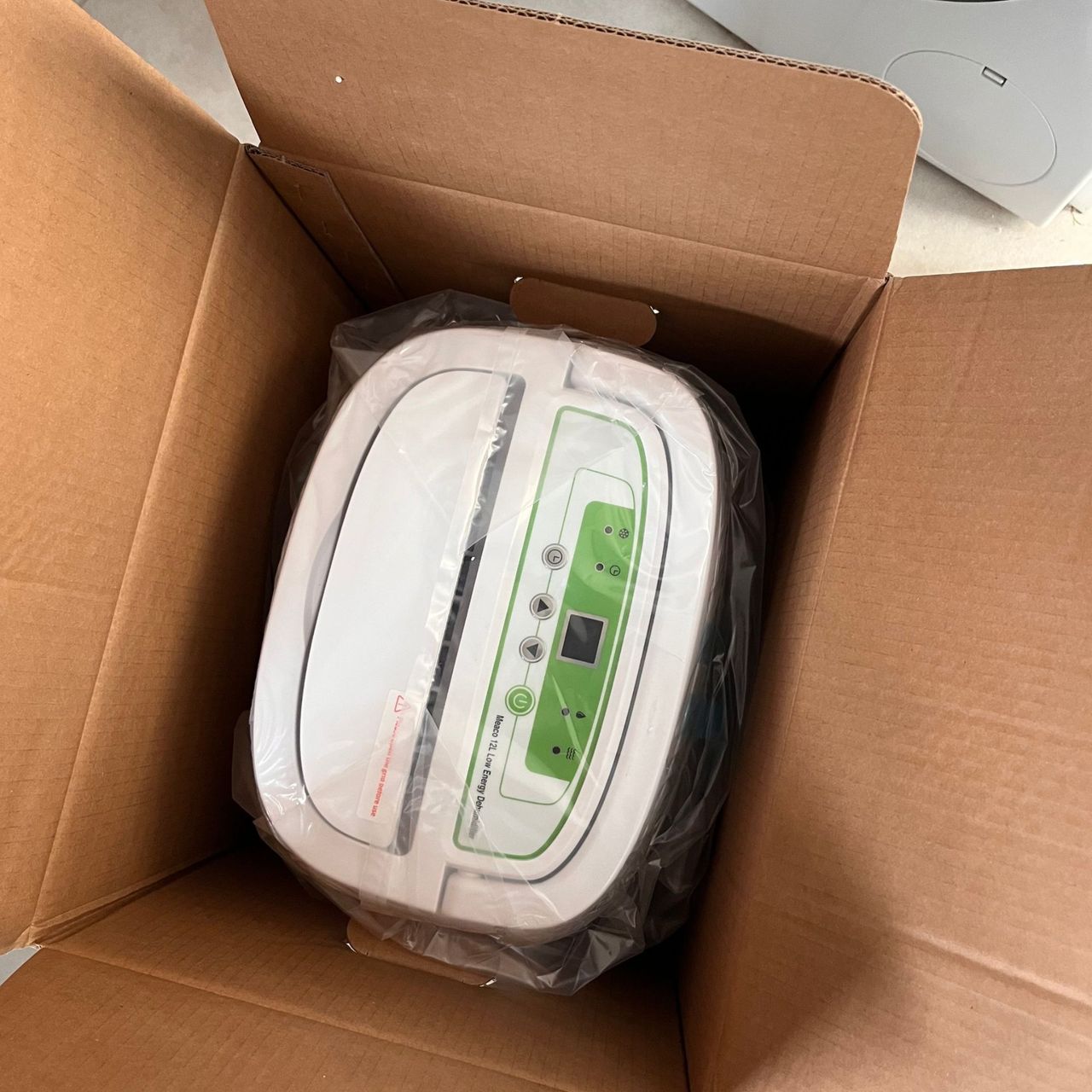 meaco 12l low energy dehumidifier with box open