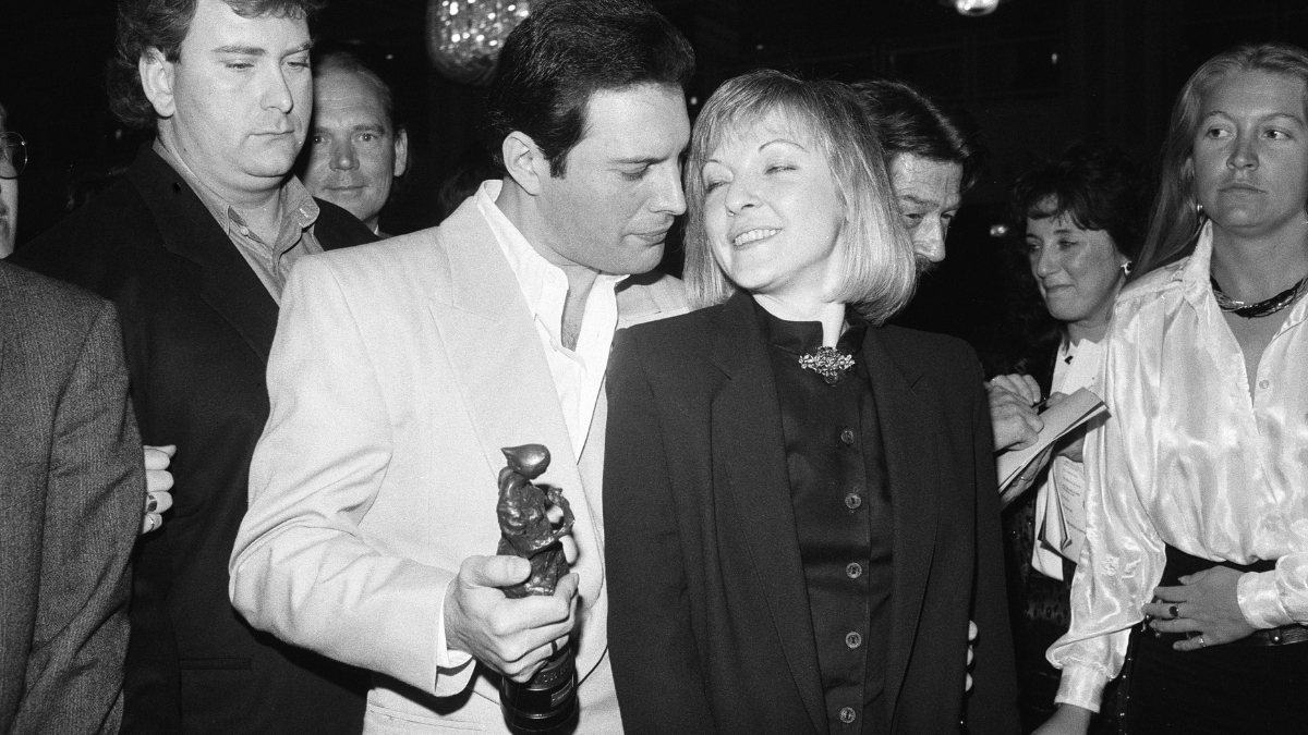 Ivor Novello Music Awards, London, Wednesday 15th April 1987. Freddie Mercury of Queen, winners of the Outstanding Contribution to British Music Award, pictured with friend Mary Austin