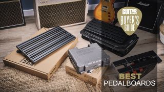Four pedalboards sat on top of their boxes on a wicker rug
