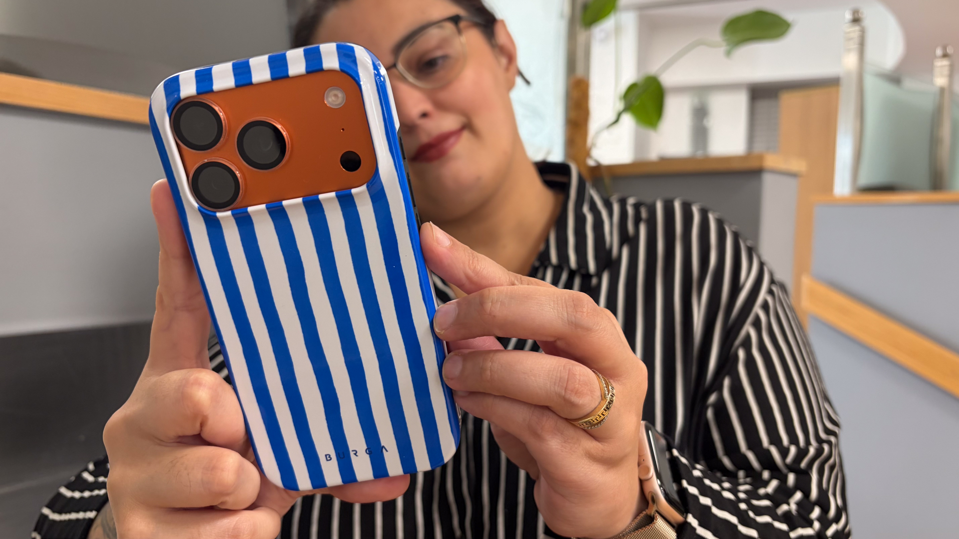 Person using an iPhone in a Burga iPhone 18 Pro case