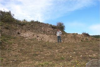 Samuel Connell, a director of the excavation, is shown alongside what has tentatively been identified as a Cayambe fortress, built to defend their lands. It was constructed with a hard volcanic material called cangahua.