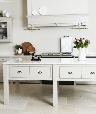 All-white kitchen with ivory worktops and cupboards