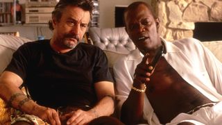 Samuel L. Jackson and Robert De Niro sit on a couch watching TV in Jackie Brown