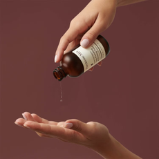 Perricone MD beauty product being poured into hand
