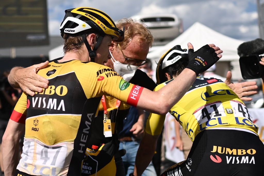 Stage winner JumboVisma teams Danish rider Jonas Vingegaard L and overall race winner JumboVisma teams Slovenian rider Primoz Roglic R celebrate at the end of the eighth and last stage of the 74th edition of the Criterium du Dauphine cycling race 1375 km between SaintAlbanLeysse and Plateau de Solaison on June 12 2022 Photo by Marco BERTORELLO AFP Photo by MARCO BERTORELLOAFP via Getty Images