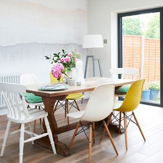 wooden dining table with white flower vase
