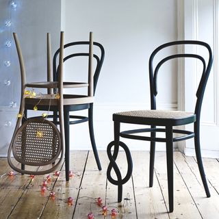 thonet bistro chair with white wall and lighting on wall