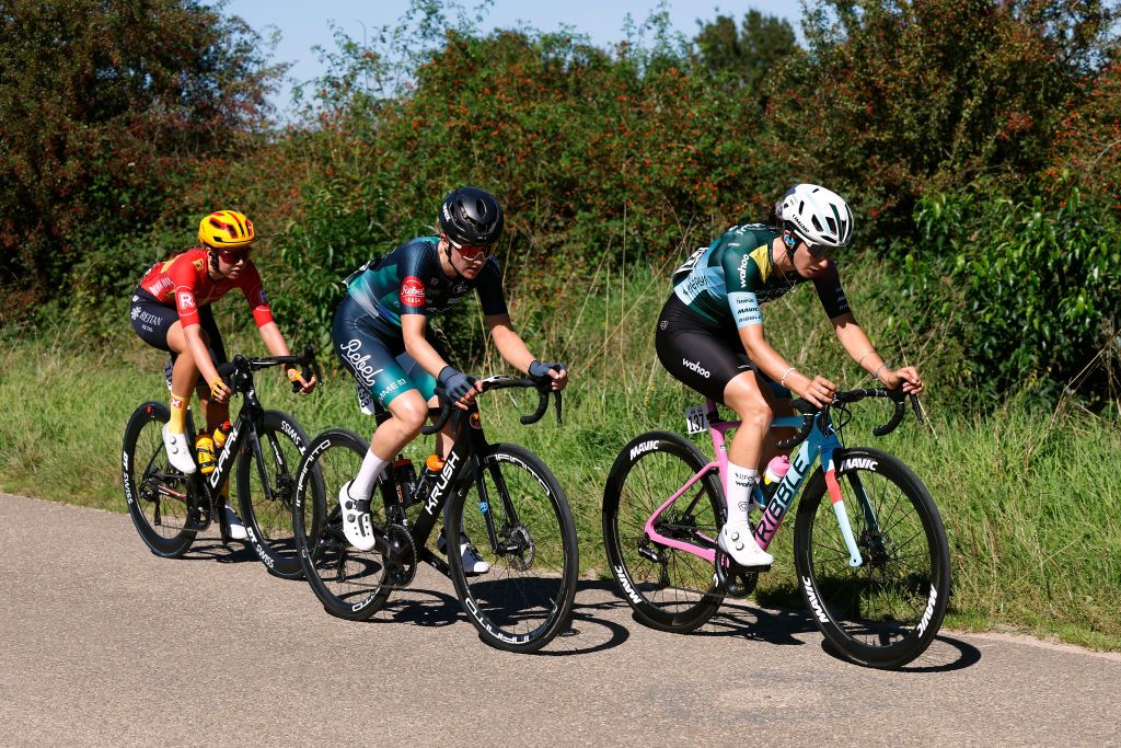 GENNEP NETHERLANDS SEPTEMBER 06 LR Amalie Lutro of Norway and UnoX Pro Cycling Team Margaux Vigie of France and Team Lifeplus Wahoo and Femke De Vries of The Netherlands and Team Krush Rebellease Pro Cycling compete in the breakaway during the 25th Simac Ladies Tour 2023 Stage 1 a 1391km stage from Gennep to Gennep UCIWWT on September 06 2023 in Gennep Netherlands Photo by Bas CzerwinskiGetty Images