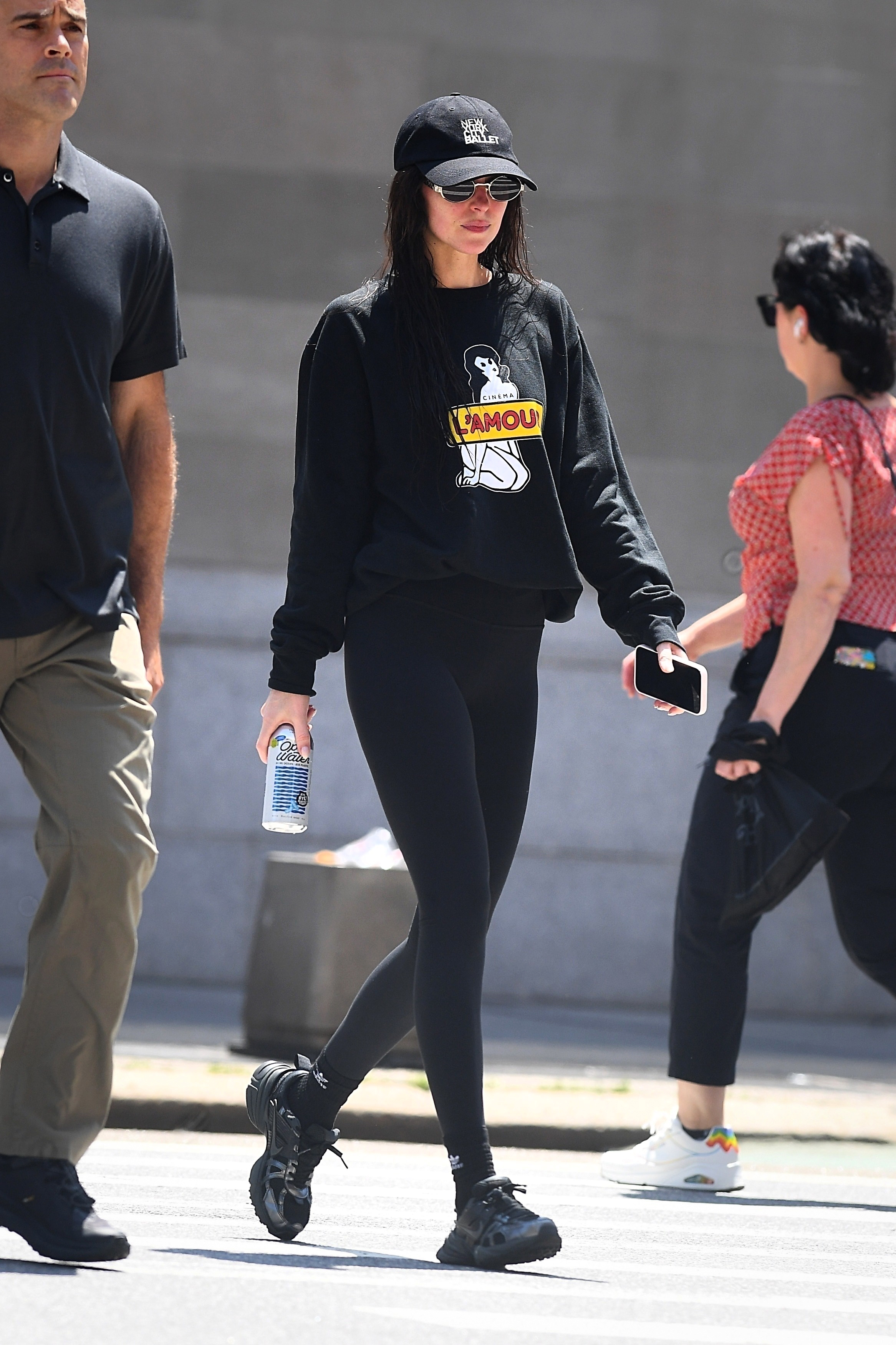 Dakota Johnson wears black Nike V2K sneakers in NYC.