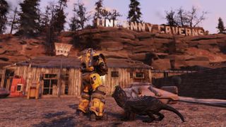 Fallout 76 Steel Reign review — a shot of a player in front of the Uncanny Caverns being attacked by a glowing mole rat