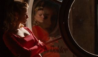 Melanie Laurent resting against a window in Inglourious Basterds