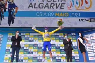 ALTO DO MALHO LOUL PORTUGAL MAY 09 Joo Rodrigues of Portugal and Team W52Fc Porto yellow leader jersey celebrates at podium during the 47th Volta Ao Algarve 2021 Stage 5 a 1701km stage from Albufeira to Alto do Malho 510m Loul Trophy Mask Hostess Flowers VoltAlgarve VAlgarve2021 on May 09 2021 in Alto do Malho Loul Portugal Photo by Luc ClaessenGetty Images