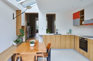 the interior of a kitchen with a side return extension