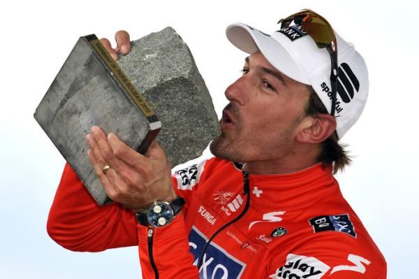 Fabian Cancellara (Saxo Bank) kisses his cobblestone trophy