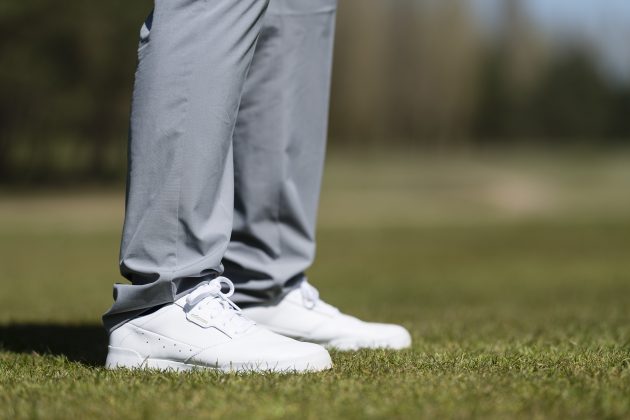 The Adidas Ultimate365 Tapered Golf Pants close up in grey