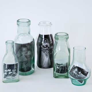 glass bottles with photographs