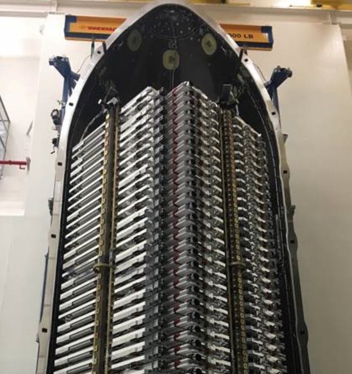 Sixty satellites for SpaceX&#039;s Starlink megaconstellation are stacked in their payload fairing ahead of a planned May 15, 2019, launch.