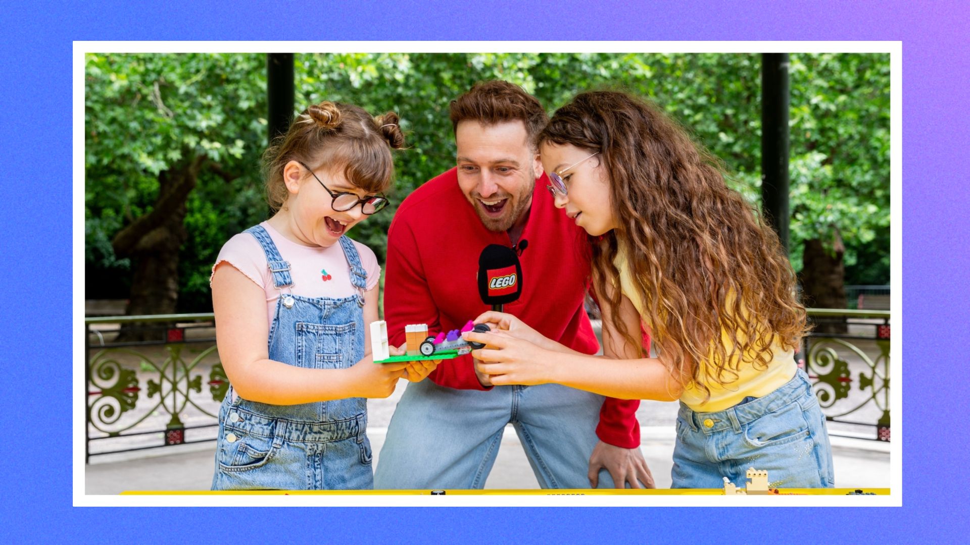 Sam Thompson building LEGO with two children 