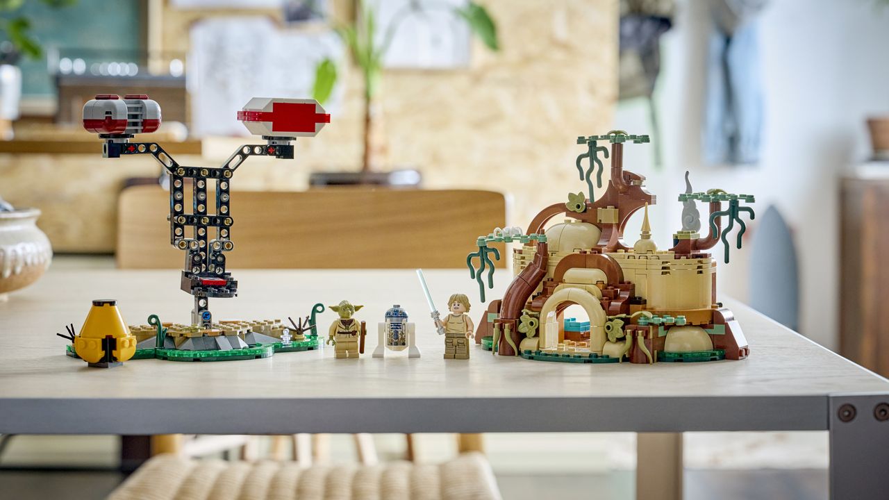 Lego Yoda's Hut and Training set and minifigures on a metal table