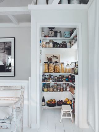 Kitchen pantry with shelves with fruit and dry ingredients