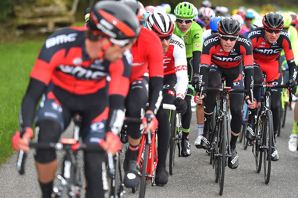 Tejay van Garderen and Brent Bookwalter ride in the shelter of the BMC team.