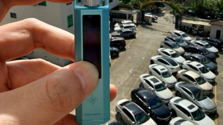 Snowsky Echo Nano leaked photo from Weibo showing a tiny music player being held up above a car park for some reason