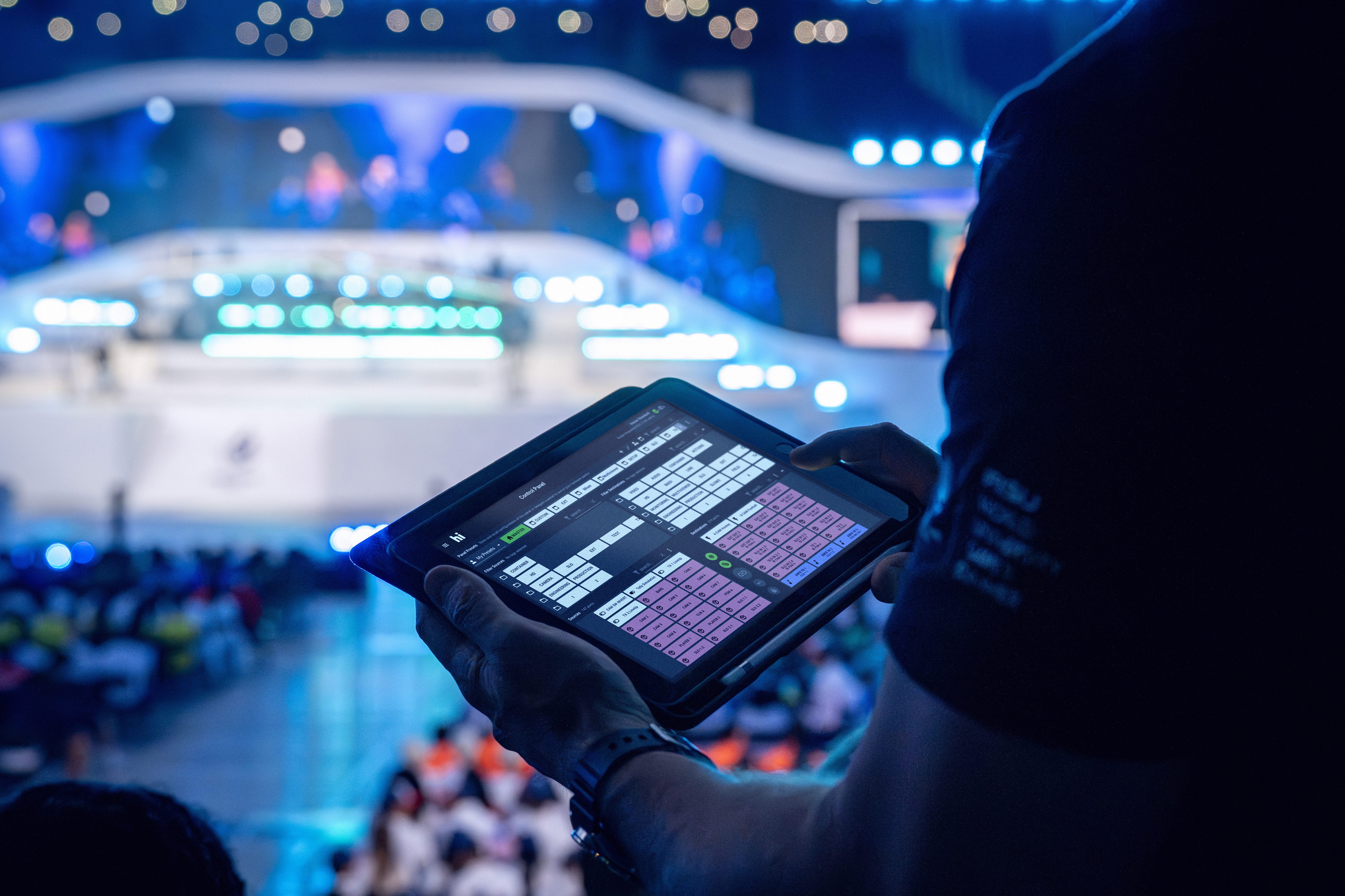 A man using Riedel's hi human interface in an arena.