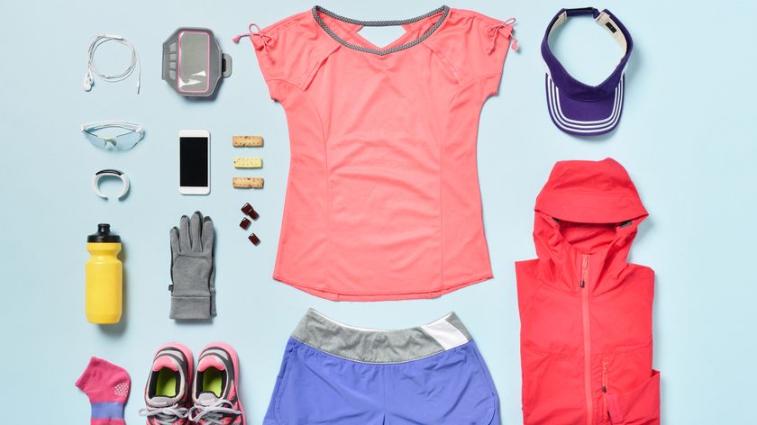 Selection of workout clothes laid out neatly on a blue background