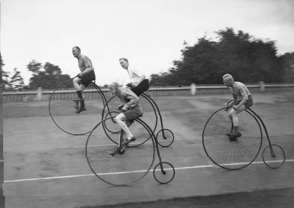 men on penny farthings