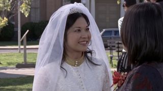 Keiko Agenda smiling as Lane Kim on her wedding day
