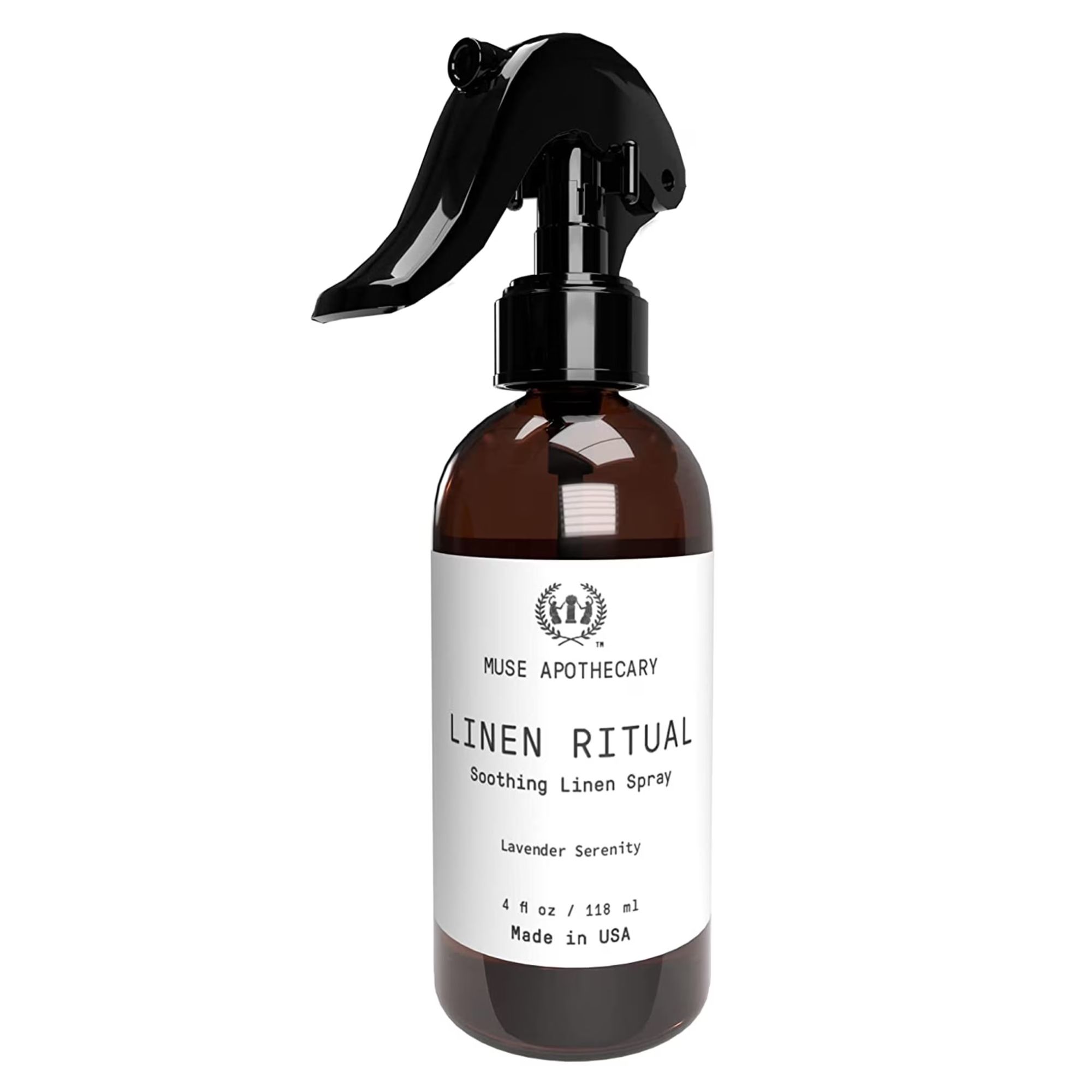 Linen spray in a dark brown bottle with white label and black spray lid.