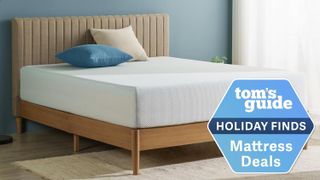 A Zinus Green Tea Memory Foam Mattress on a bed frame in a bedroom, a Tom's Guide Holiday Finds deal graphic (right)