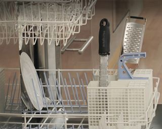 a close up of food graters sat upright in a dishwasher