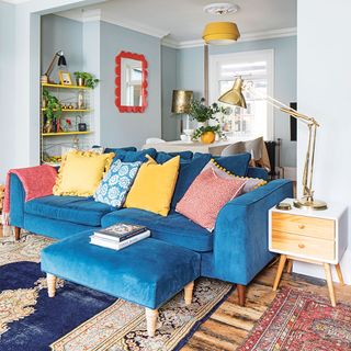 open plan living room with blue velvet sofa