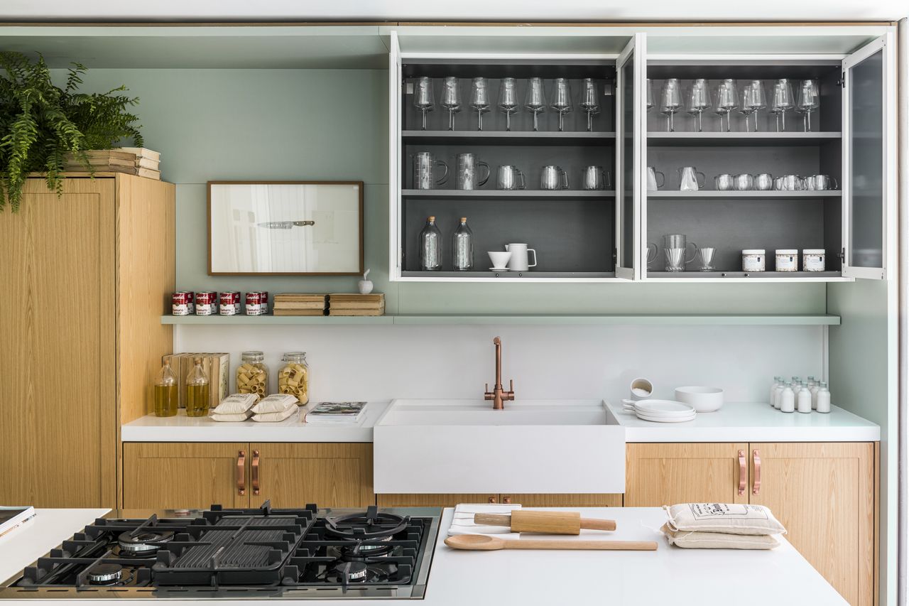 A kitchen with a white Butler&#039;s sink